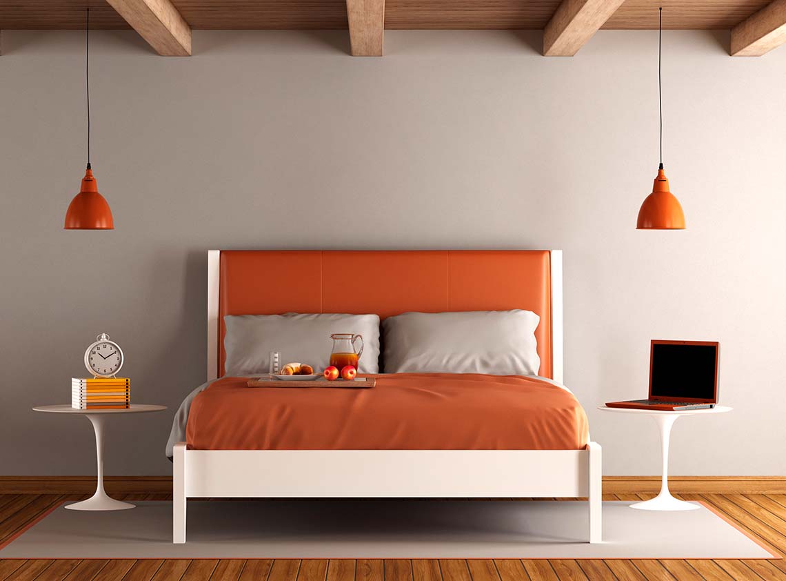 Dormitorio cálido y minimalista con cabecero color arcilla